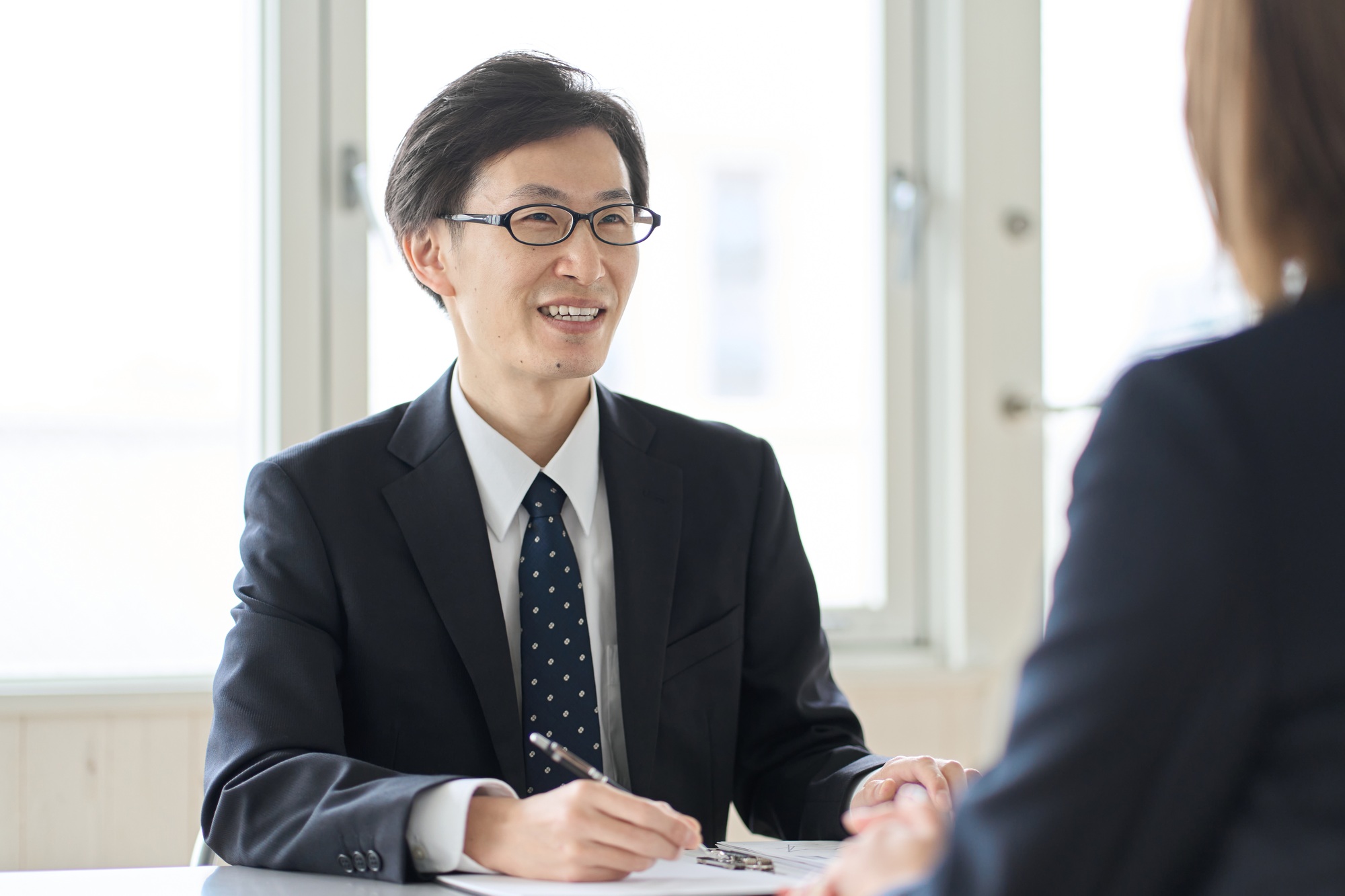 Asian male tax accountant receiving tax consultation